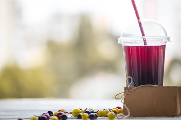 a glass tube with a summer berry drink