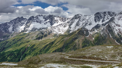 Fototapeta na wymiar Gavia pass view in july with snowed mountains