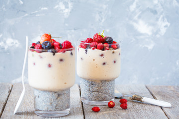 Healthy chia pudding with smoothies and berries in a glass.