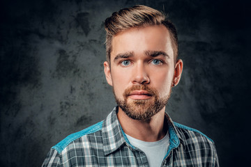 Bearded man over grey background.