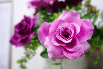 Fake flower and Floral background. rose flowers made of fabric. The fabric flowers bouquet. Colorful of decoration artificial flower