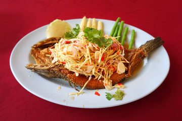 Deep fried Snake-head fish with Mixed Herb, Thai food - Pla Shon Lui Suan.