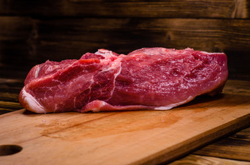 Raw pork meat on cutting board