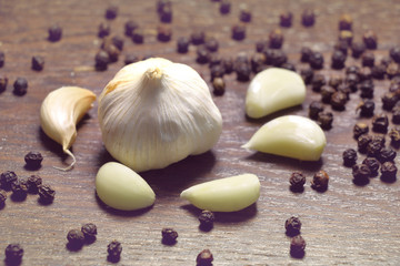 garlic. fresh garlic. cloves of garlic and black pepper, ingredients for thai food on wooden table background