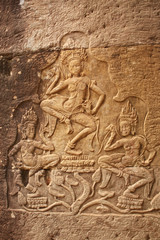 Stone bas-relief of three dancing womens, Angkor Wat, Cambodia