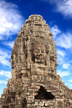 Giant stone face in Prasat Bayon Temple, Angkor Wat complex, Cambodia