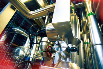 Equipment, cables and piping as found inside of a modern industrial power plant