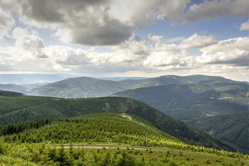 Fototapeta na wymiar View of three wind power plants in the mountains