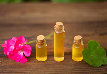 Essence of flowers on table in beautiful glass jar