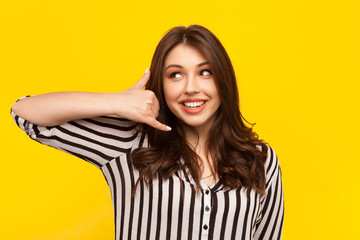 Fototapeta premium Girl gesturing as talking phone