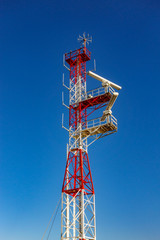 Communication tower against blue sky