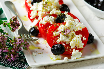 Tomato and Feta Cheese Salad.style rustic.selective focus