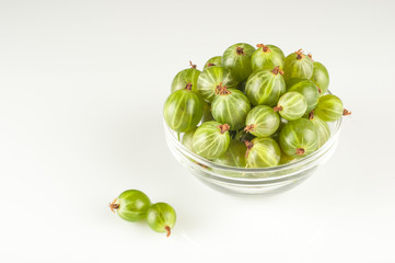 Gooseberry smoothie in a jar on a white table