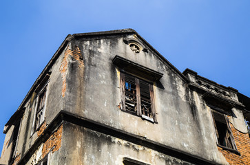 Close up of an old damaged French architectural house in Hanoi capital, Vietnam 