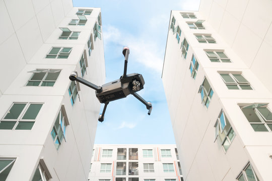 Drone Flying Over On Building Background.