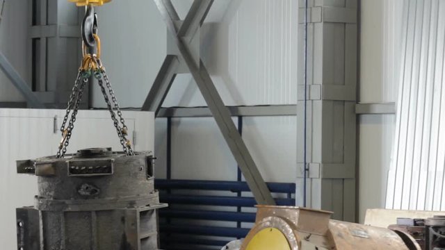working crane indoors at factory. working gantry crane. crane in the shop