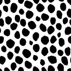 Black hand painted dots on white background. Stylish minimalist seamless vector pattern