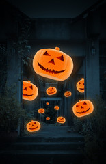 Jack O Lantern pumpkin fly over old damaged building at night time, Mysterious background, Halloween concept