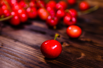 Fresh ripe cherries on wooden table