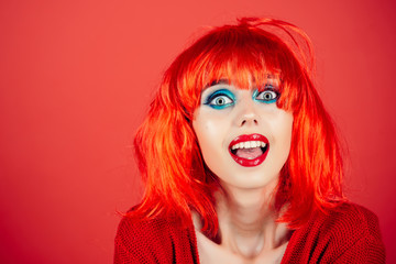 Woman in red wig with fashionable makeup.