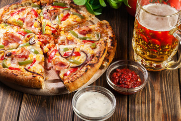 Homemade pizza with bacon, paprika and corn