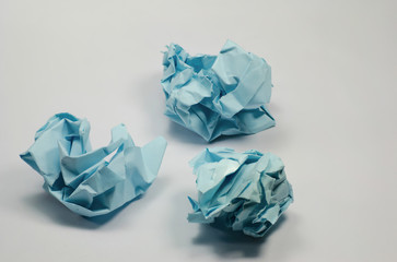 The blue paper is crumpled.