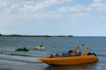 yellow power sport tourist boat, jet skis at the Black Sea