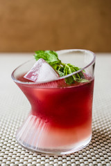 Malibu Sunset Cocktail with mint leaves..