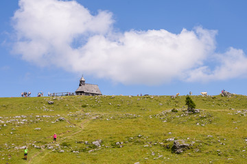 Velika planina plateau, Slovenia, Mountain village in Alps, wooden houses in traditional style, popular hiking destination