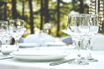 Tableware - cutlery and white plates.