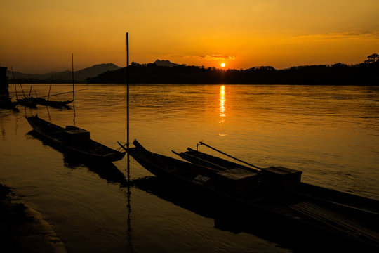Tropical sunset above Mekong Laos
