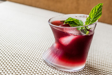 Malibu Sunset Cocktail with mint leaves..