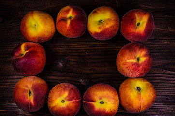 Fresh ripe peaches on wooden table. Top view
