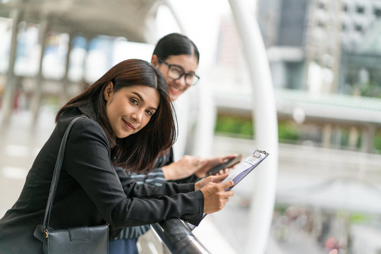 Two business woman check report before presentation to customer