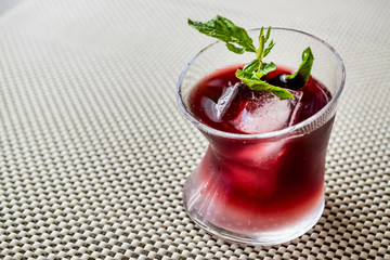 Malibu Sunset Cocktail with mint leaves..