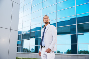 businessman standing on the background of the business center