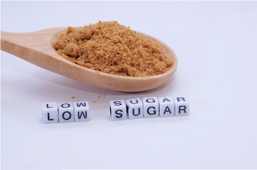 sugar on wooden spoon