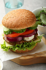 beef burger with lettuce and mayonnaise