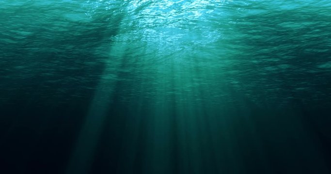 perfectly seamless loop of deep blue caribbean ocean waves from underwater background, light rays shining through