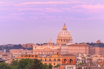 Fototapeta na wymiar The view from the Pincian Hill overlooking St. Peter Basilica during beautiful sunset in Rome, Italy.