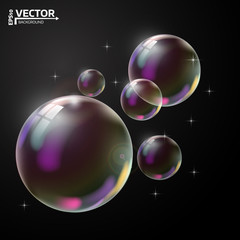 Transparent soap bubble on black background