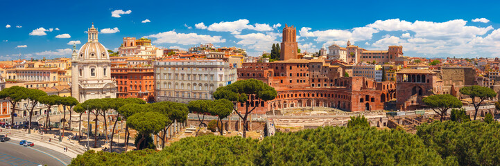 Fototapeta na wymiar Panoramic view with ancient ruins of Trajan Forum, Market, Trajan Column and church Most Holy Name of Mary in sunny day, Rome, Italy