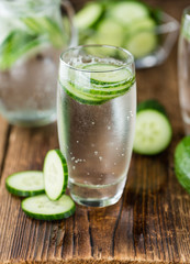 Cucumber Water on vintage wooden background