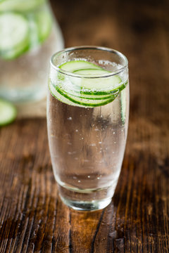 Fresh made Cucumber Water on a rustic background