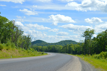 Fototapeta na wymiar A sharp turn, a beautiful country road