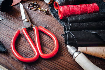 cobbler tools in workshop on wooden background mock up