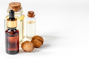 cosmetic and therapeutic walnut oil on white background