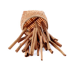 Cinnamon sticks in bamboo wooden  isolated on white background