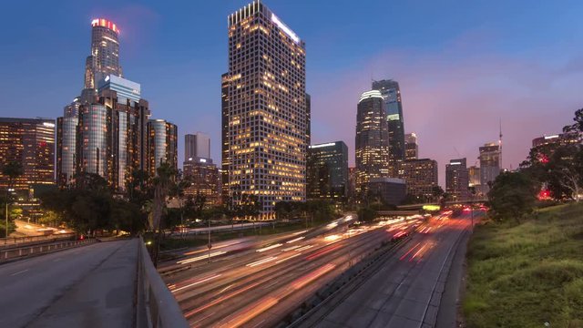 Freeway traffic in downtown Los Angeles at sunset