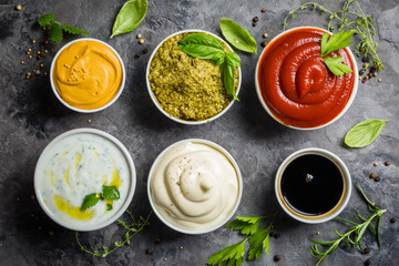 Selection of different sauces in bowls - obrazy, fototapety, plakaty